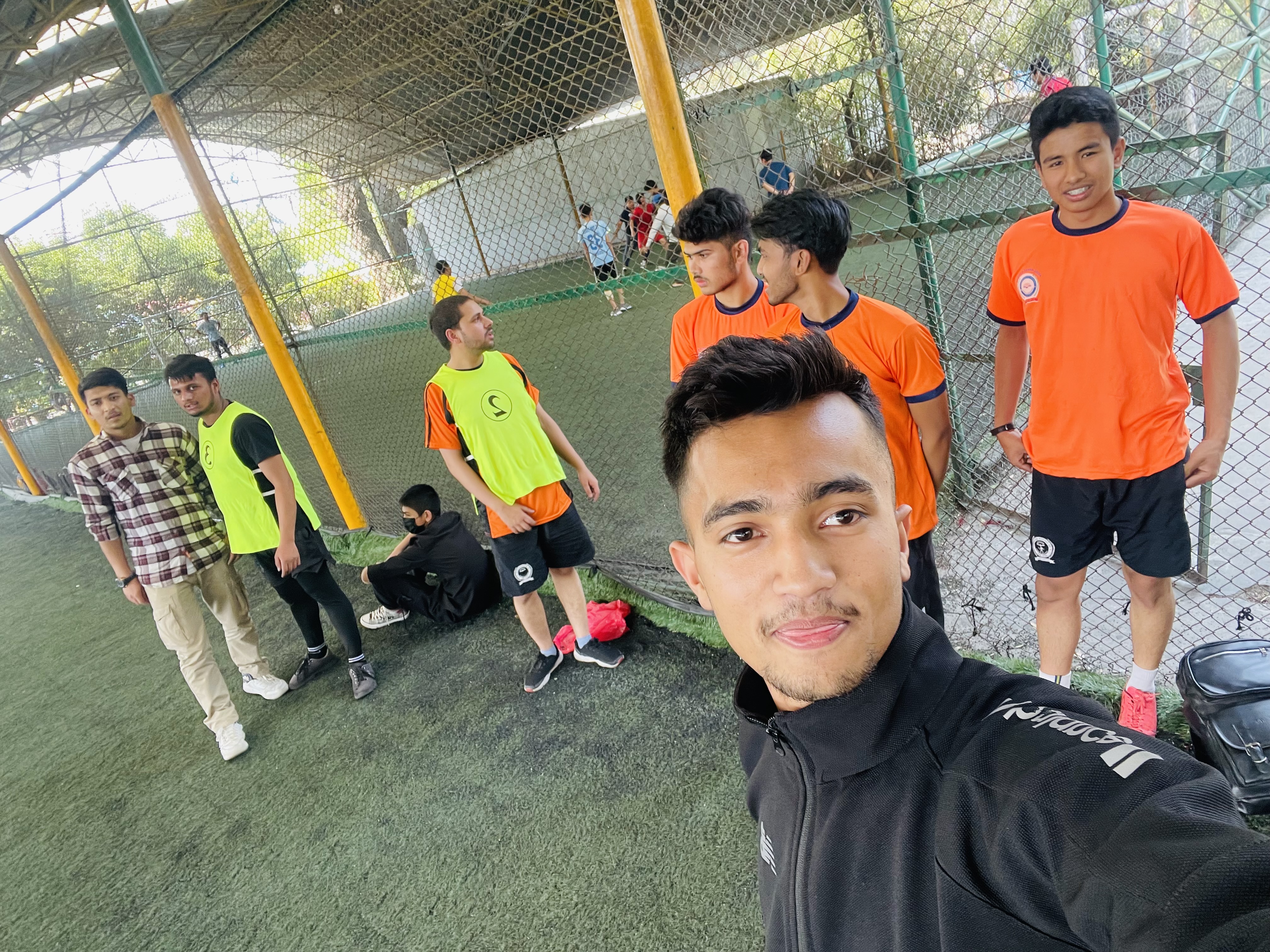 Officer Candidates taking a picture during futsal event